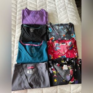 Scrub pants and shirts. Small for all but one top, medium pants. 7 sets